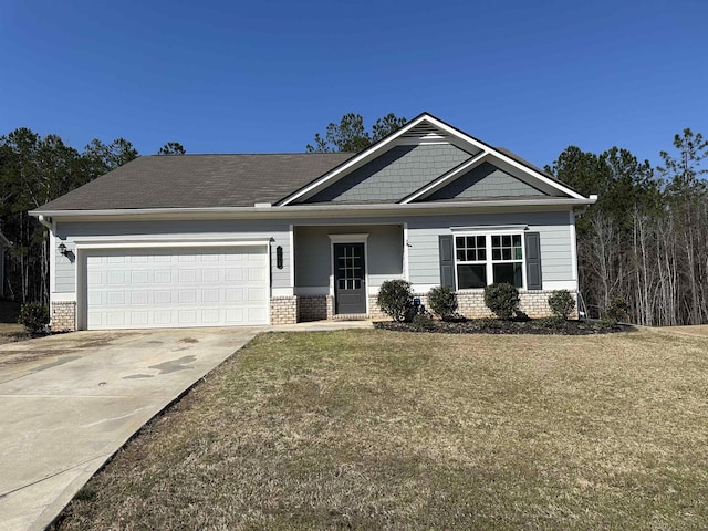 craftsman house with a garage, brick siding, driveway, and a front lawn