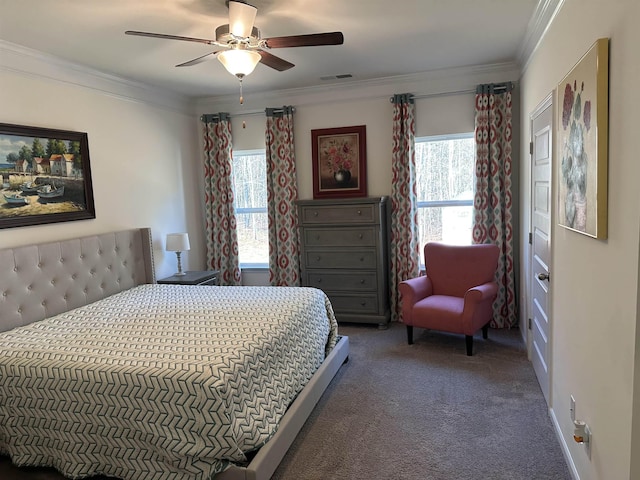 carpeted bedroom featuring visible vents, multiple windows, ornamental molding, and a ceiling fan