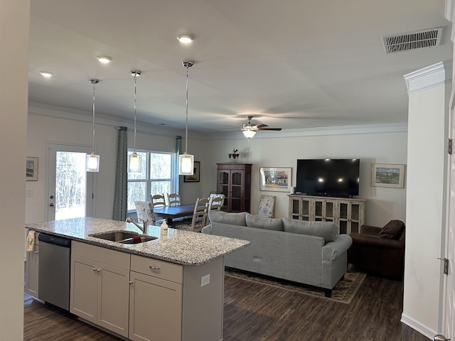 kitchen with a center island with sink, visible vents, dishwasher, crown molding, and a sink