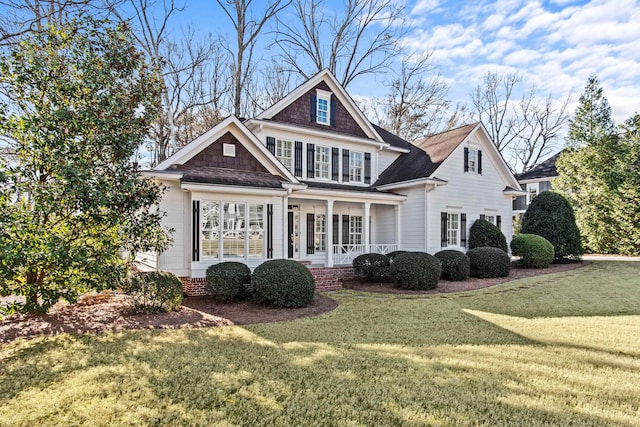 view of front facade with a porch and a front yard