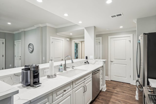 1050A Tailwater, Greensboro, GA 30642 - kitchen featuring a sink, stainless steel appliances, dark wood-style flooring, ornamental molding, and recessed lighting