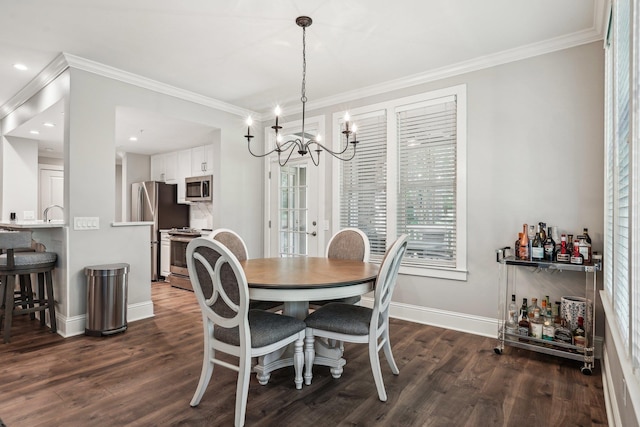 1050A Tailwater, Greensboro, GA 30642 - dining room with crown molding, dark wood-style floors, baseboards, a chandelier, and a bar