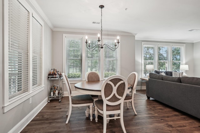 1050A Tailwater, Greensboro, GA 30642 - dining space featuring ornamental molding, a chandelier, baseboards, and dark wood finished floors