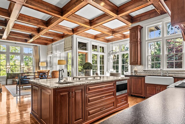 2030 Linger Longer Dr, Greensboro, GA 30642 - kitchen with wood finished floors, coffered ceiling, and a sink