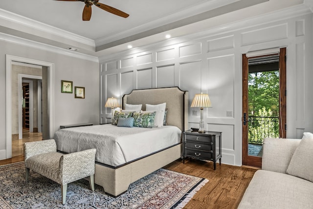 2030 Linger Longer Dr, Greensboro, GA 30642 - bedroom featuring recessed lighting, wood finished floors, a decorative wall, access to outside, and ornamental molding