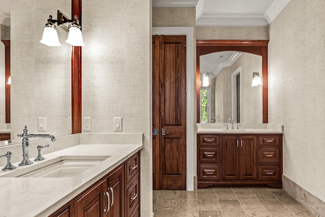 2030 Linger Longer Dr, Greensboro, GA 30642 - bathroom featuring two vanities, ornamental molding, wallpapered walls, and a sink
