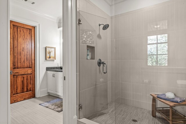 2030 Linger Longer Dr, Greensboro, GA 30642 - full bath with vanity, a shower stall, and ornamental molding