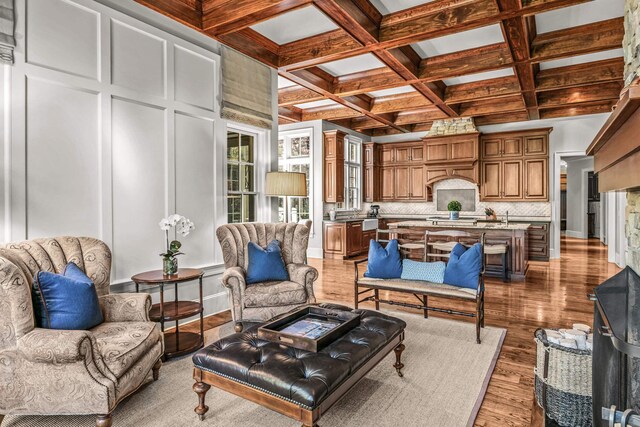 2030 Linger Longer Dr, Greensboro, GA 30642 - living area with wood finished floors, coffered ceiling, and beamed ceiling