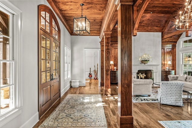 2030 Linger Longer Dr, Greensboro, GA 30642 - foyer entrance featuring wood finished floors, a notable chandelier, and wooden ceiling