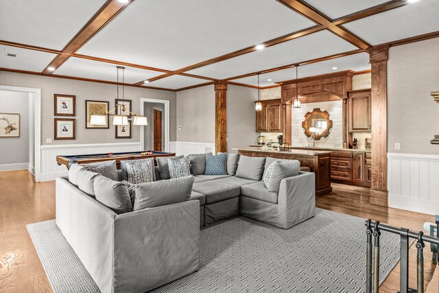 2030 Linger Longer Dr, Greensboro, GA 30642 - living room featuring ornamental molding, wood finished floors, coffered ceiling, and wainscoting