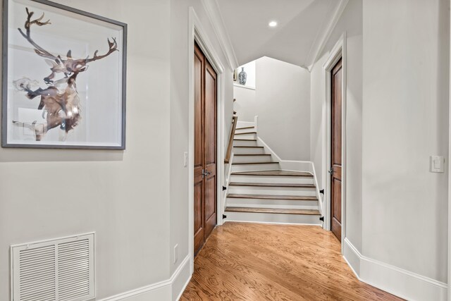 2030 Linger Longer Dr, Greensboro, GA 30642 - hall with recessed lighting, stairs, visible vents, baseboards, and wood finished floors