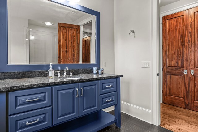 2030 Linger Longer Dr, Greensboro, GA 30642 - full bathroom featuring wood finished floors, vanity, and baseboards