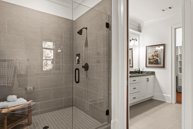 2030 Linger Longer Dr, Greensboro, GA 30642 - bathroom with visible vents, ornamental molding, a shower stall, and tile patterned flooring