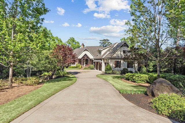 2030 Linger Longer Dr, Greensboro, GA 30642 - view of front of property with a garage, a chimney, and driveway