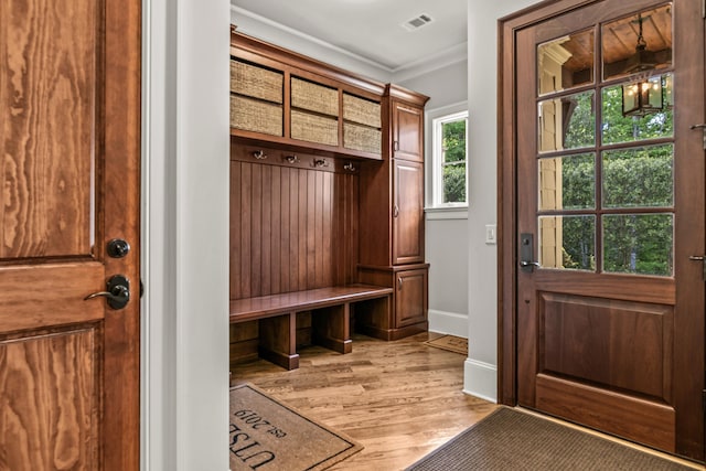 2030 Linger Longer Dr, Greensboro, GA 30642 - mudroom featuring crown molding, visible vents, baseboards, and light wood-type flooring