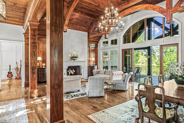 2030 Linger Longer Dr, Greensboro, GA 30642 - living area with an inviting chandelier, wooden ceiling, wood finished floors, and high vaulted ceiling