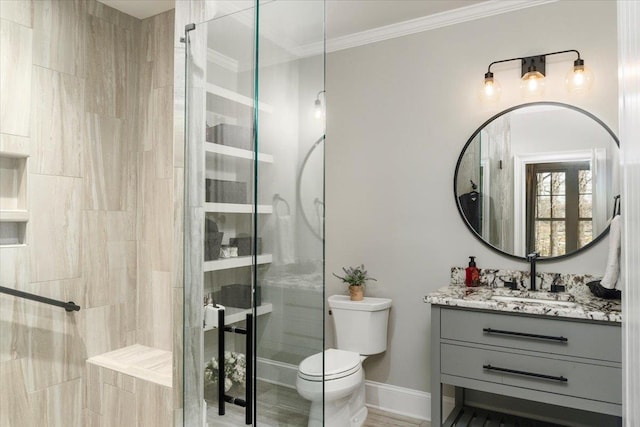 full bath with toilet, a shower stall, crown molding, and vanity