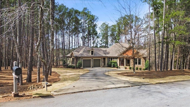 view of front of house with a garage and concrete driveway