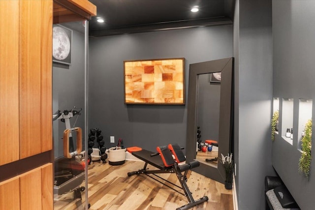 exercise area with recessed lighting and wood finished floors