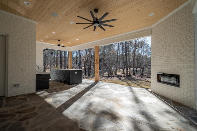 view of patio / terrace featuring ceiling fan