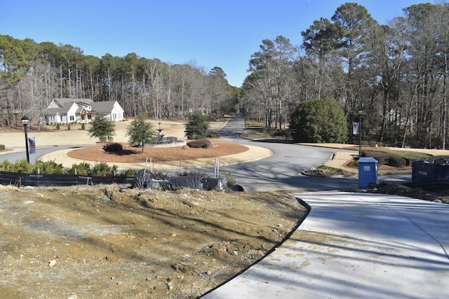 view of street with a wooded view