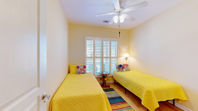 bedroom featuring ceiling fan and wood-type flooring