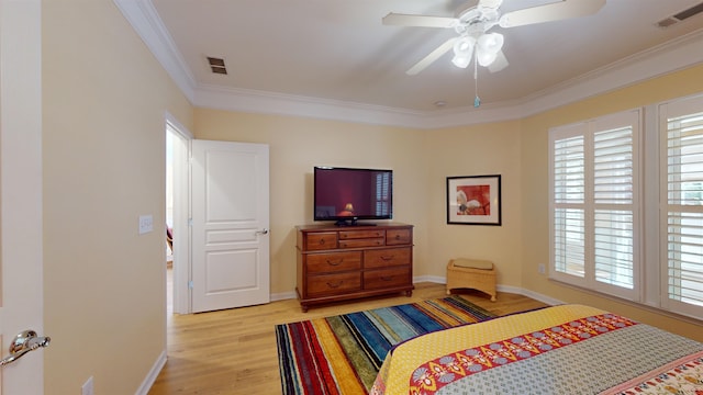 bedroom with crown molding, ceiling fan, and light wood-type flooring