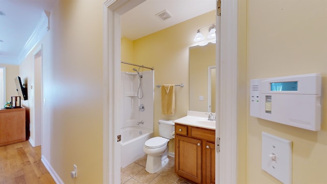 full bathroom featuring vanity, tile patterned floors, shower / bathtub combination, and toilet