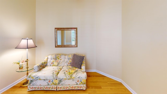 sitting room featuring wood-type flooring