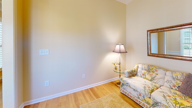 living area with hardwood / wood-style floors