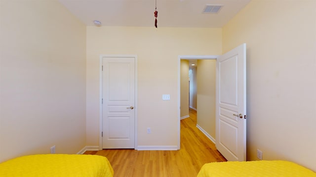 unfurnished bedroom featuring wood-type flooring