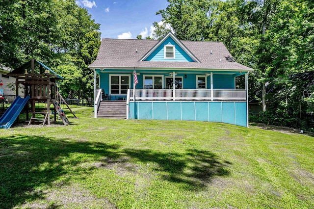 138B Little River Run, Eatonton, GA 31024 - back of property featuring a playground, a lawn, and a shingled roof
