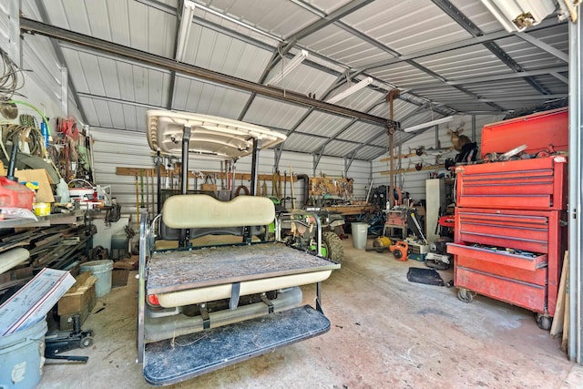 138B Little River Run, Eatonton, GA 31024 - garage with a workshop area and metal wall