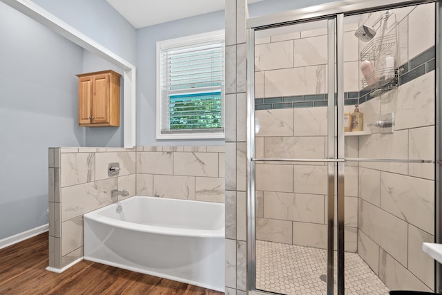 138B Little River Run, Eatonton, GA 31024 - bathroom featuring a bath, wood finished floors, and a shower stall
