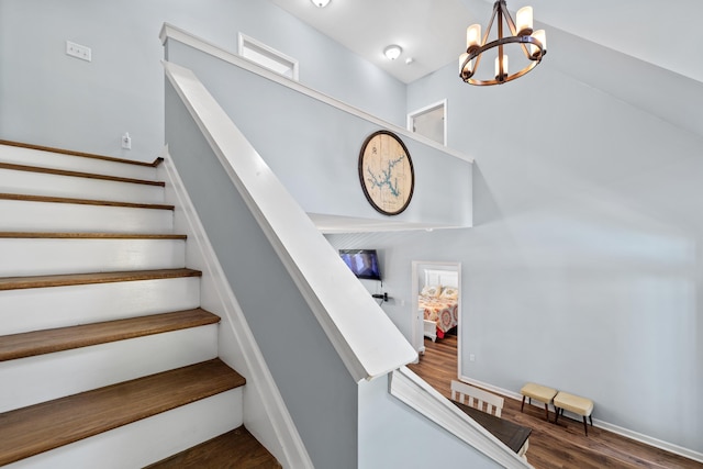 138B Little River Run, Eatonton, GA 31024 - stairway with wood finished floors and a chandelier