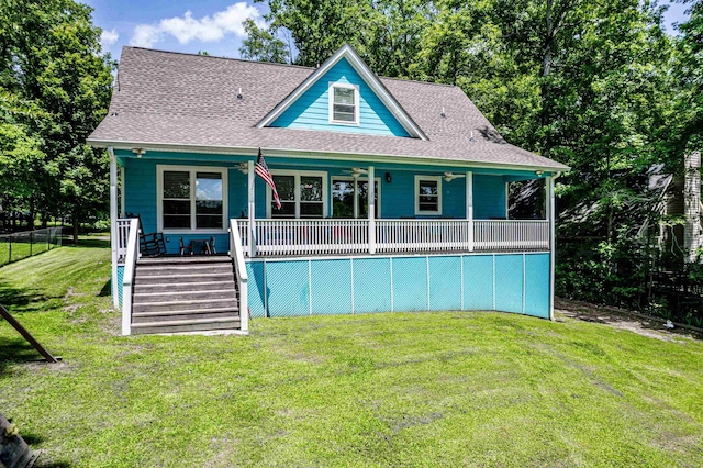 138B Little River Run, Eatonton, GA 31024 - rear view of house featuring stairway, a shingled roof, a porch, and a lawn