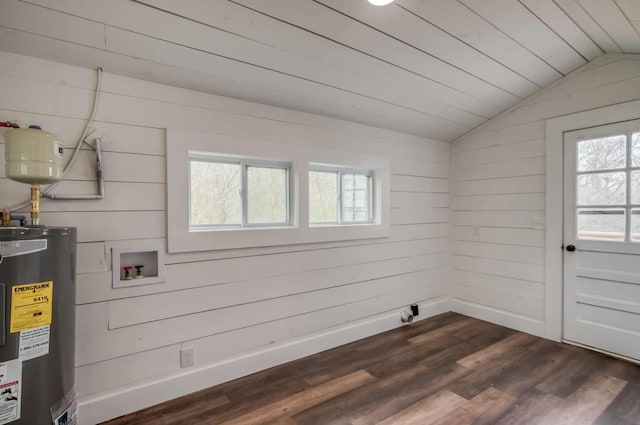 clothes washing area with laundry area, baseboards, dark wood-type flooring, water heater, and washer hookup