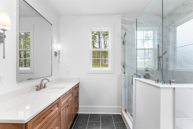 1731 Osprey Poynte, Greensboro, GA 30642 - bathroom featuring a stall shower, baseboards, vanity, and tile patterned floors
