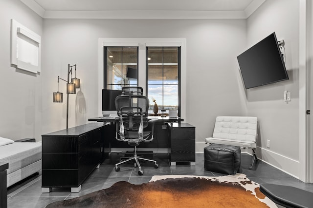 office area featuring baseboards, crown molding, and dark tile patterned flooring