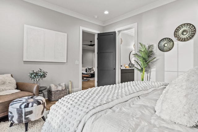 bedroom with ornamental molding, wood finished floors, and recessed lighting