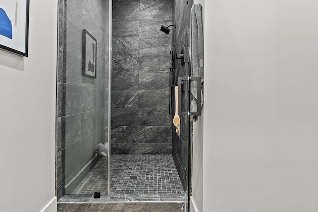 full bath with a shower stall