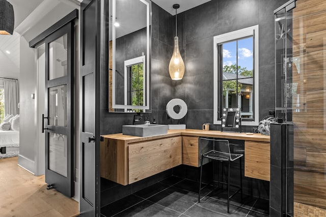 bathroom with ensuite bathroom and vanity