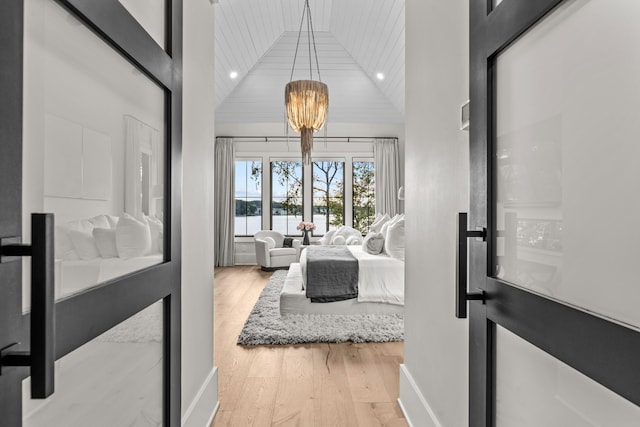 interior space featuring baseboards, wood ceiling, light wood-type flooring, high vaulted ceiling, and recessed lighting