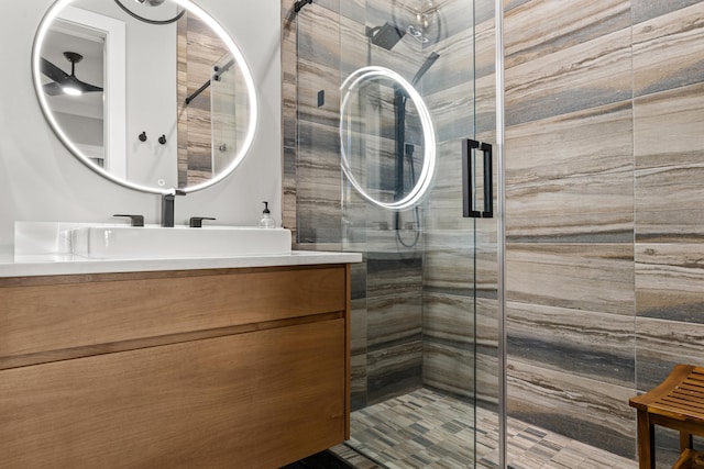 full bath with a shower stall and vanity