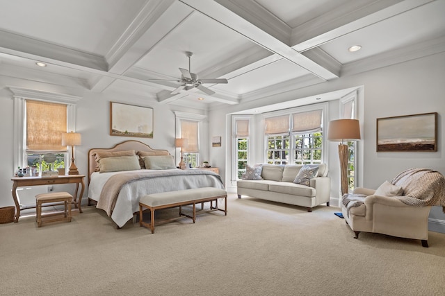 bedroom featuring ceiling fan, carpet, coffered ceiling, ornamental molding, and beamed ceiling