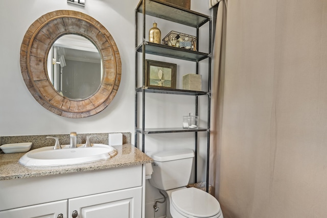 bathroom with vanity and toilet