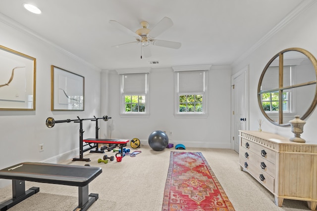 workout area featuring light carpet, ornamental molding, and ceiling fan