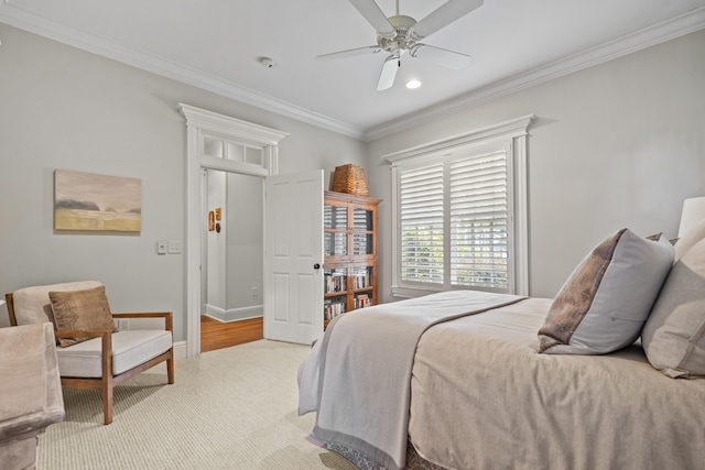 bedroom featuring crown molding, ceiling fan, and light carpet