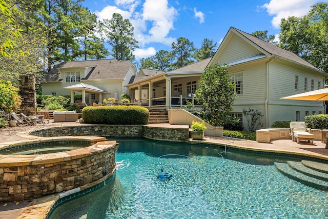 view of swimming pool featuring an in ground hot tub, outdoor lounge area, and a patio