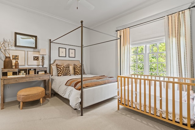 bedroom with crown molding, carpet flooring, and ceiling fan